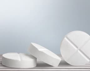 Aspirin pills on table